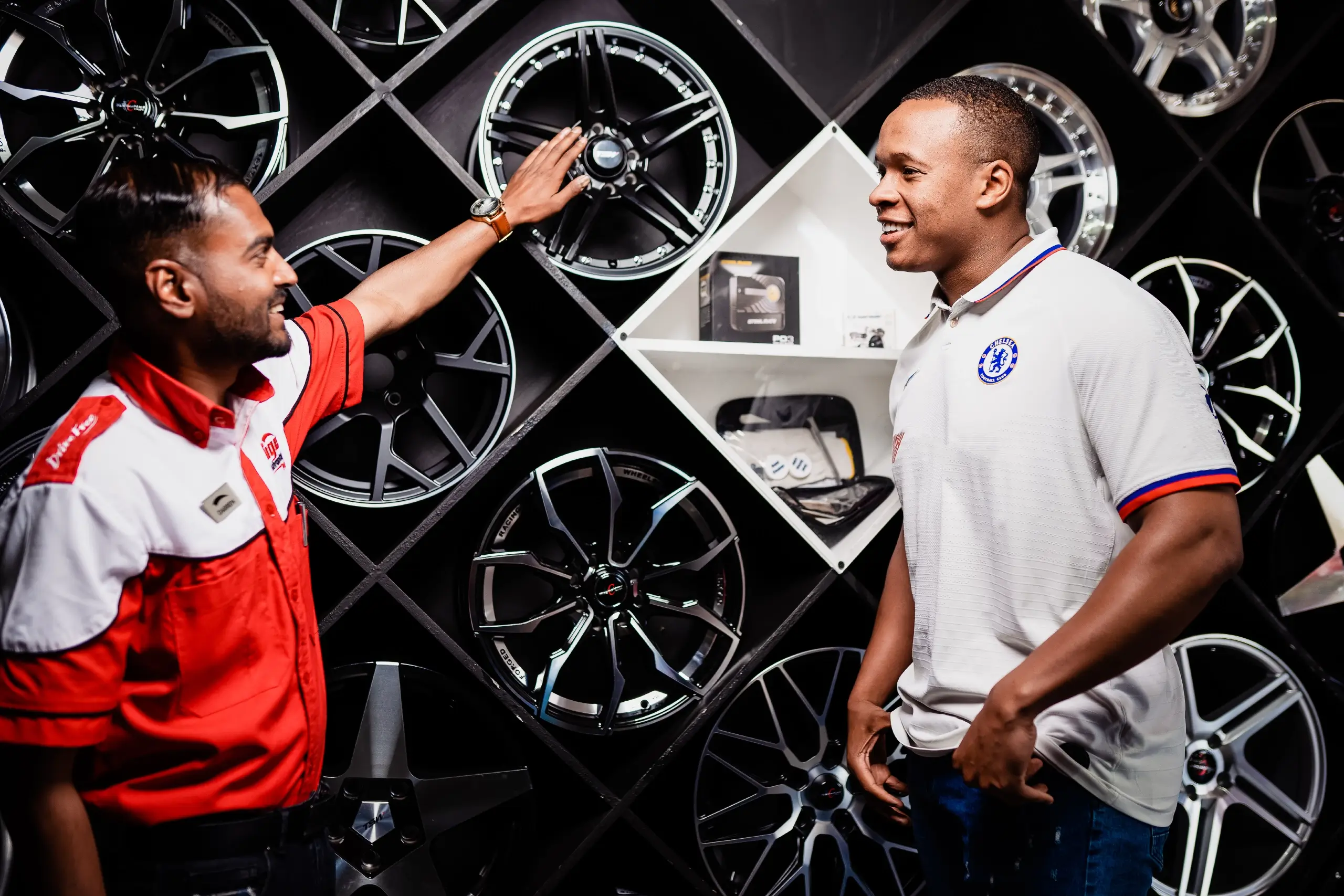 A Tiger Wheel & Tyre salesperson advising a customer